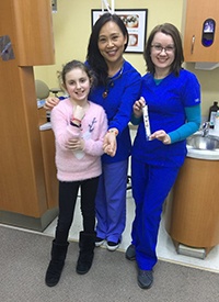 Dr. Wang dental assistant and young patient