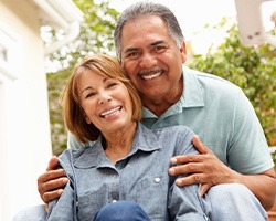 Patient in Rolling Meadows smiling confidently with new dentures