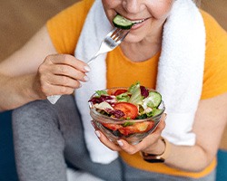 Dentures patient in Rolling Meadows enjoying a salad