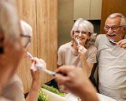 Older patients brushing their remaining teeth
