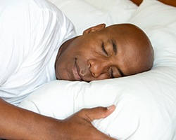 Man sleeping soundly in bed