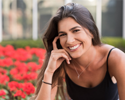 Closeup of woman with white, straight teeth smiling