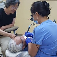 Dr. Wang treating patient