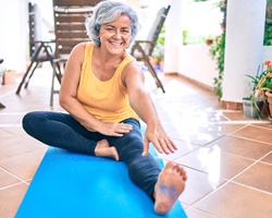 woman smiling while exercising