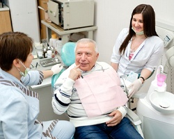 Patient learning dental implant post-op instructions in Rolling Meadows