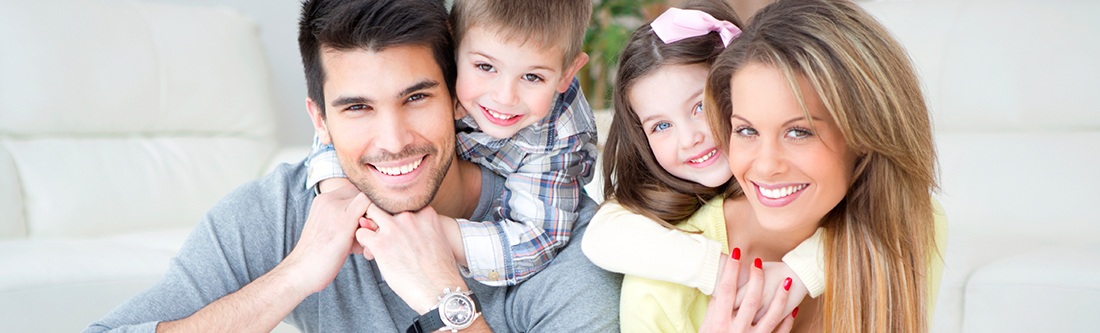 Smiling mother father and two children