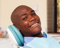 Smiling man in dental chair