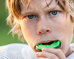 Teen boy placing sportsguard