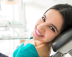 Young woman smiling in dental chair