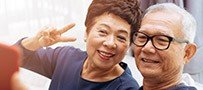 Happy older man and woman smiling together