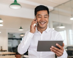 person working and looking at their tablet