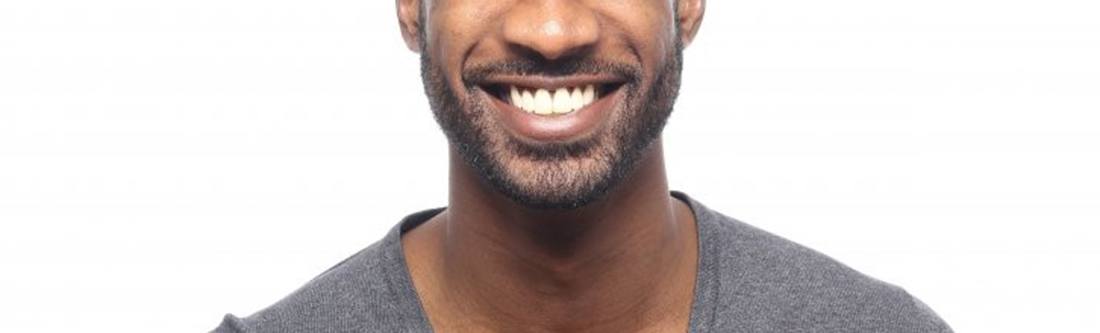 man in black shirt smiling with veneers in Rolling Meadows