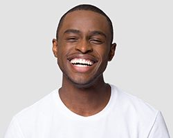 Man with bright smile after teeth whitening in Rolling Meadows