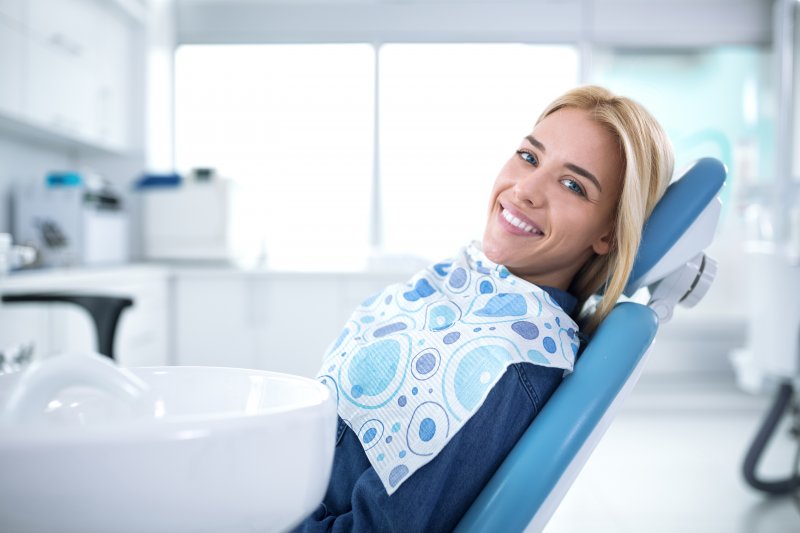 person smiling at cosmetic dentist’s office