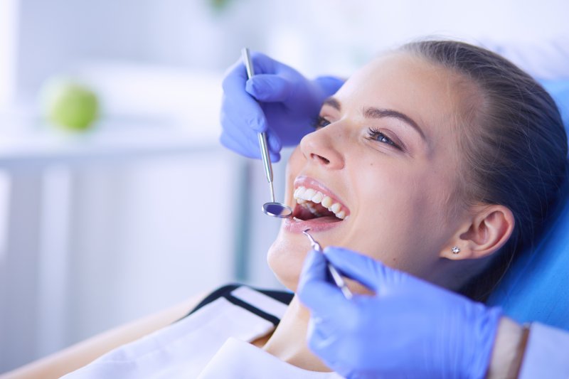 A woman being assessed by her local dentist
